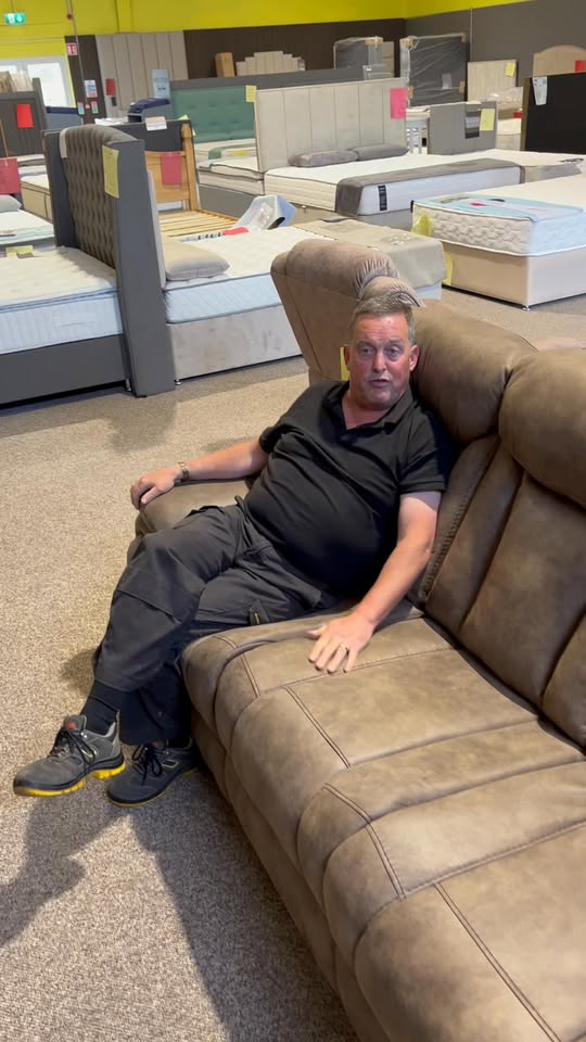 Ashton power-recliner three-seater sofa on display in the Mattress Madness showroom