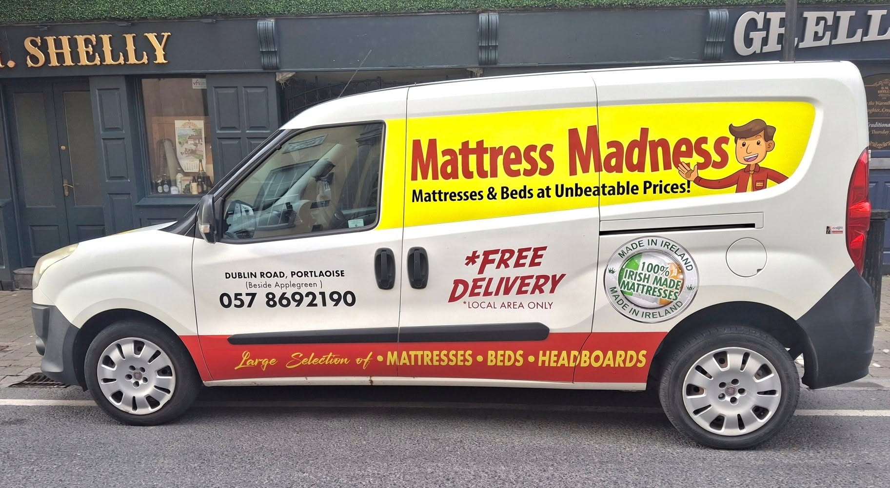 The Mattress Madness free local delivery van advertising mattresses, beds and headboards
